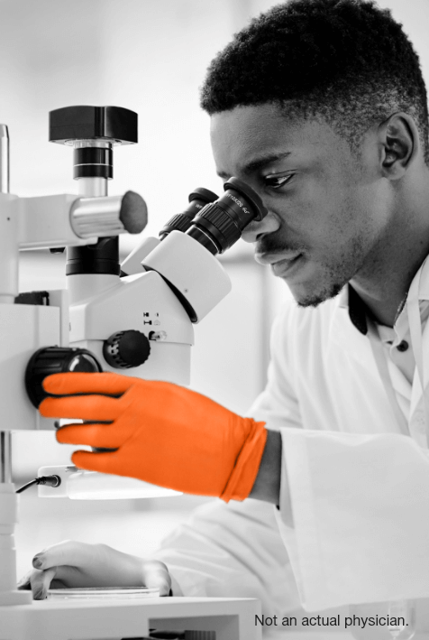 Man looking through microscope