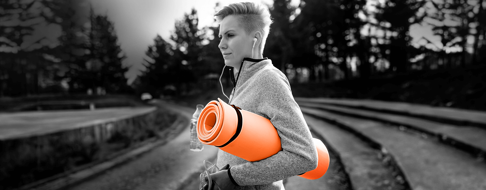 Woman with yoga mat