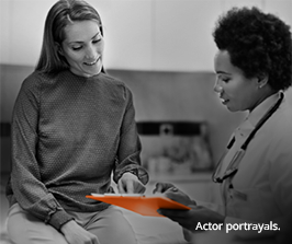 Women looking into document Women looking into document